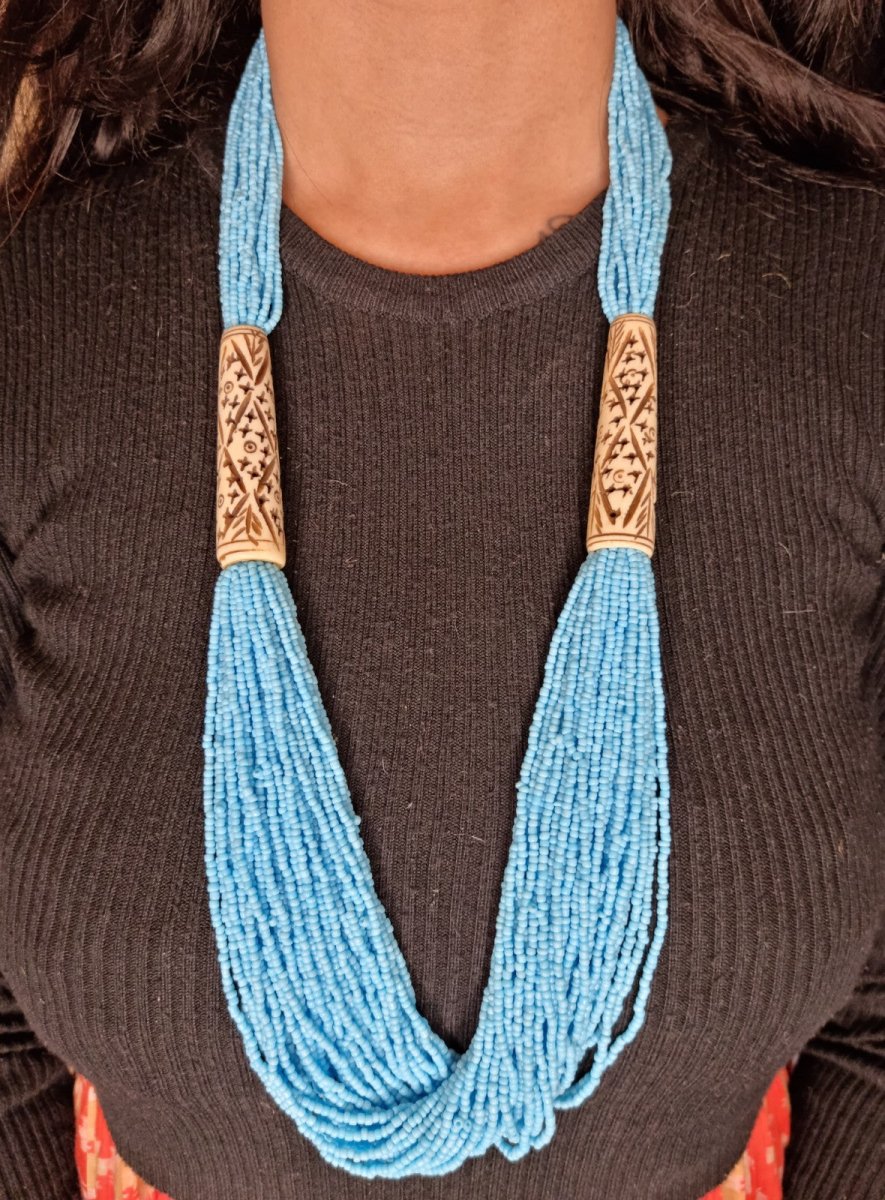 Glass-Bead & Carved-Bone Tribal Fluted Necklace in black - Ekobae